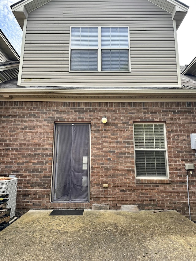 3804 Polo Club Blvd, Lexington, KY 40509 - property entrance with brick siding, central AC, and a patio