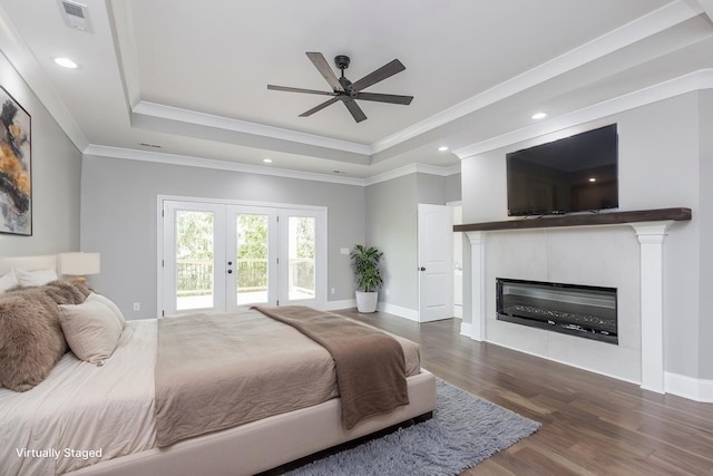 2269 Savannah Ln, Lexington, KY 40513 - bedroom with a raised ceiling, access to outside, french doors, wood finished floors, and a glass covered fireplace