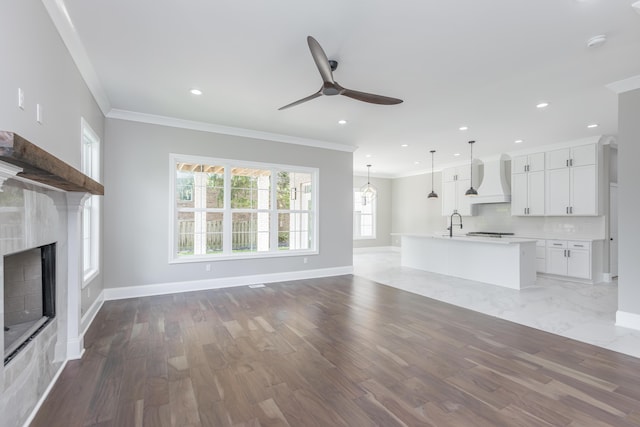 2269 Savannah Ln, Lexington, KY 40513 - unfurnished living room with ornamental molding, a ceiling fan, a fireplace, baseboards, and recessed lighting
