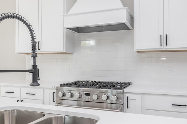 2269 Savannah Ln, Lexington, KY 40513 - kitchen featuring custom range hood, stainless steel range with gas stovetop, and light countertops