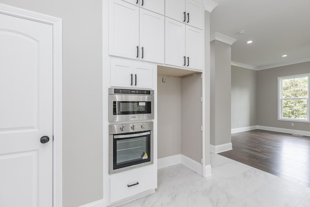 2269 Savannah Ln, Lexington, KY 40513 - kitchen featuring crown molding, baseboards, white cabinets, double oven, and recessed lighting