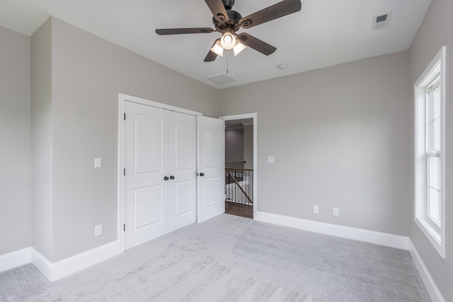 2269 Savannah Ln, Lexington, KY 40513 - unfurnished bedroom with carpet floors, baseboards, a closet, and ceiling fan