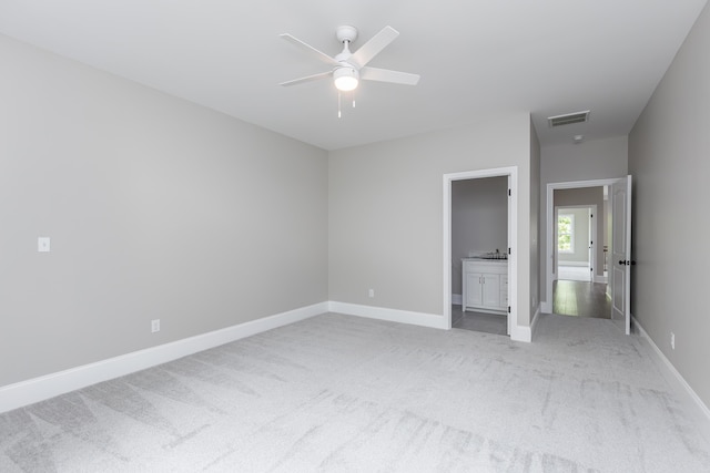2269 Savannah Ln, Lexington, KY 40513 - unfurnished bedroom featuring light colored carpet, baseboards, connected bathroom, and a ceiling fan