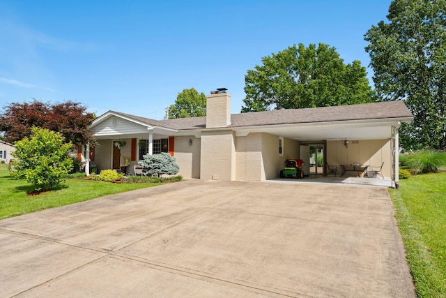 256 Michael Blvd, Frankfort, KY 40601 - ranch-style home with concrete driveway, a front yard, a carport, and a chimney