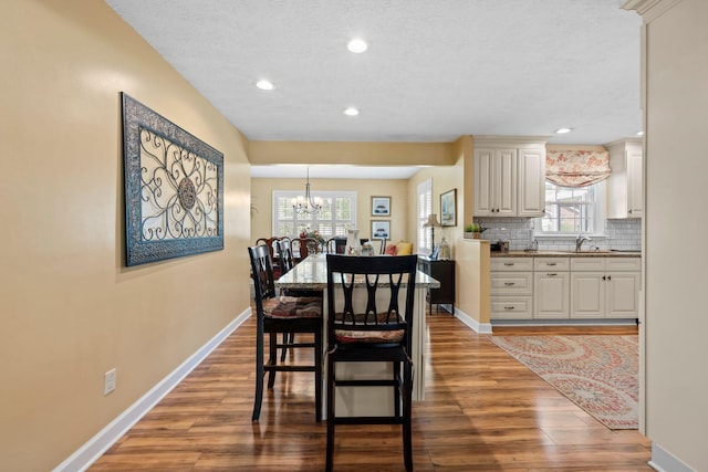 256 Michael Blvd, Frankfort, KY 40601 - dining area with wood finished floors, baseboards, a chandelier, healthy amount of natural light, and recessed lighting