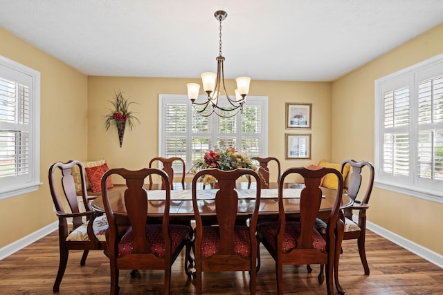 256 Michael Blvd, Frankfort, KY 40601 - dining area featuring a chandelier, dark wood-style flooring, and baseboards