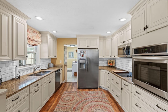 256 Michael Blvd, Frankfort, KY 40601 - kitchen with stainless steel appliances, a sink, wood finished floors, decorative backsplash, and recessed lighting