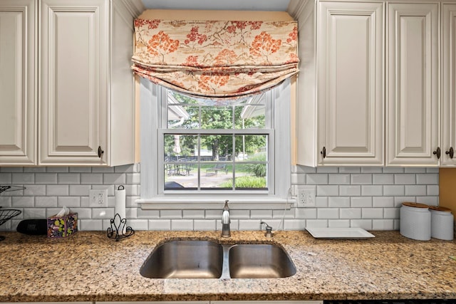 256 Michael Blvd, Frankfort, KY 40601 - kitchen with a sink, tasteful backsplash, light stone countertops, and white cabinets