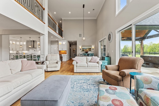 502 W Brannon Rd, Nicholasville, KY 40356 - living room featuring a high ceiling, light wood finished floors, crown molding, and recessed lighting