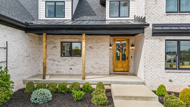 502 W Brannon Rd, Nicholasville, KY 40356 - property entrance with a porch, a standing seam roof, metal roof, and brick siding