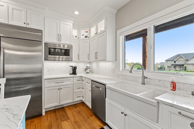 502 W Brannon Rd, Nicholasville, KY 40356 - kitchen with built in appliances, light wood-style flooring, white cabinetry, a sink, and recessed lighting