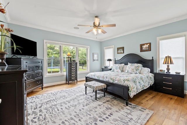 502 W Brannon Rd, Nicholasville, KY 40356 - bedroom with light wood-style flooring, crown molding, baseboards, and a ceiling fan