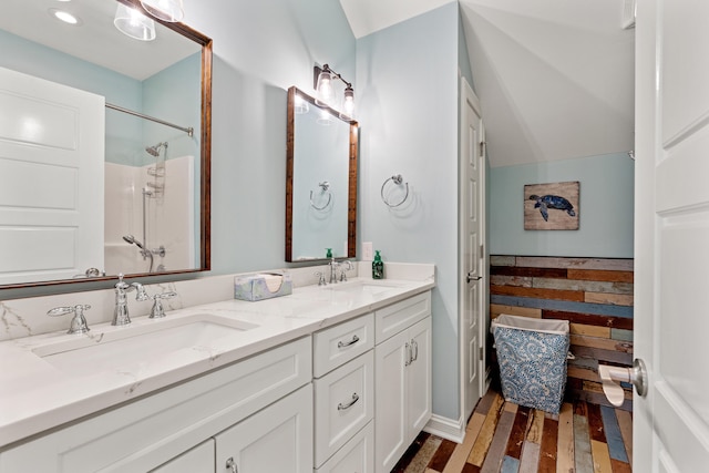 502 W Brannon Rd, Nicholasville, KY 40356 - full bathroom with wood finished floors, double vanity, and a shower