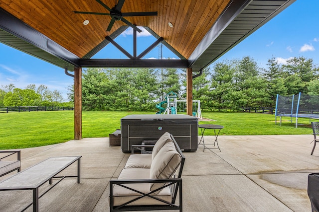 502 W Brannon Rd, Nicholasville, KY 40356 - view of patio featuring a trampoline, a playground, a ceiling fan, and view of wooded area