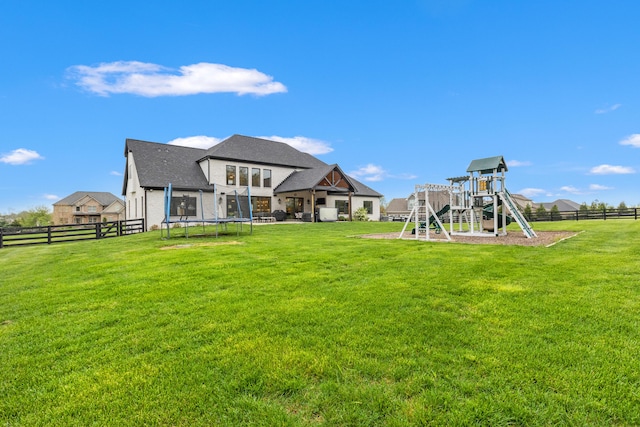 502 W Brannon Rd, Nicholasville, KY 40356 - view of yard featuring a trampoline and a playground