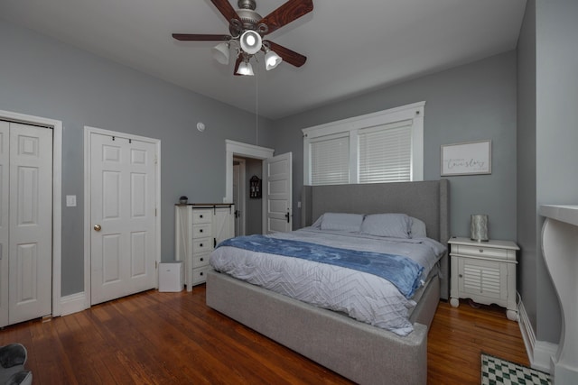bedroom with wood finished floors, baseboards, and a ceiling fan