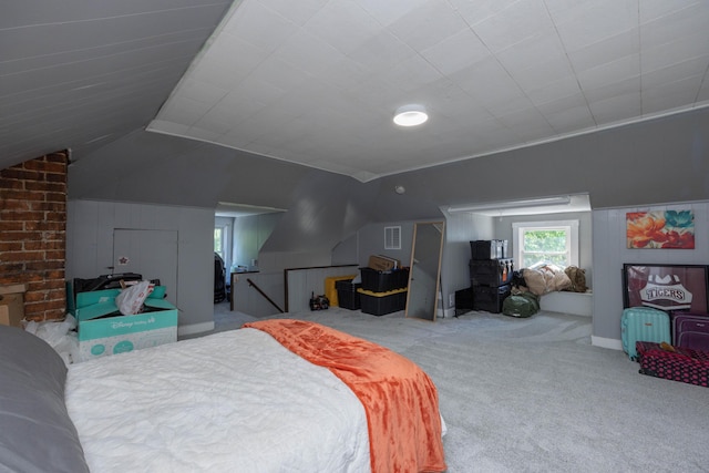 bedroom featuring vaulted ceiling and carpet floors