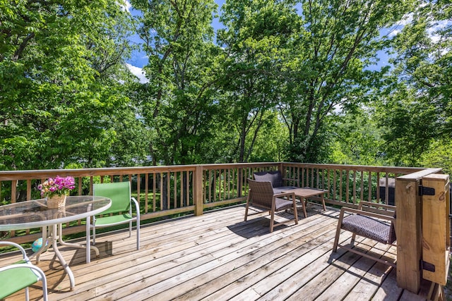 wooden deck with outdoor dining space