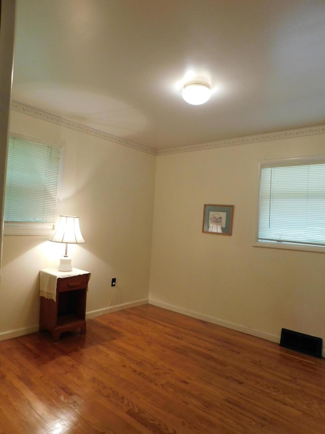 184 Meadow Dr, Harlan, KY 40831 - unfurnished room with wood finished floors and baseboards