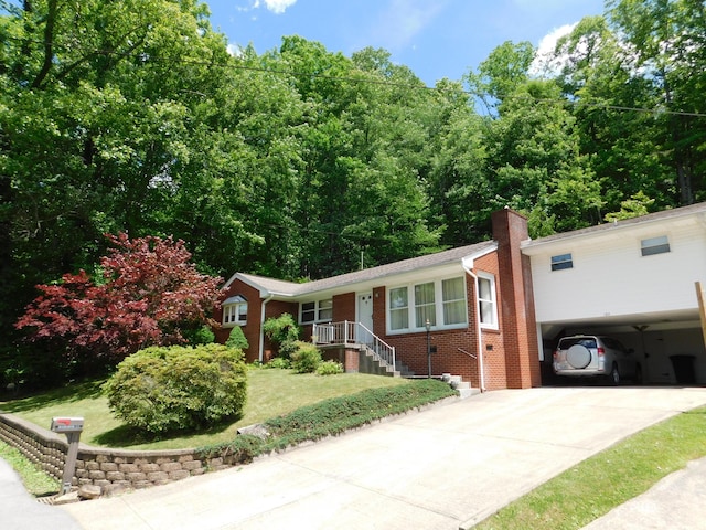 184 Meadow Dr, Harlan, KY 40831 - ranch-style house with brick siding, driveway, a chimney, a carport, and a front yard