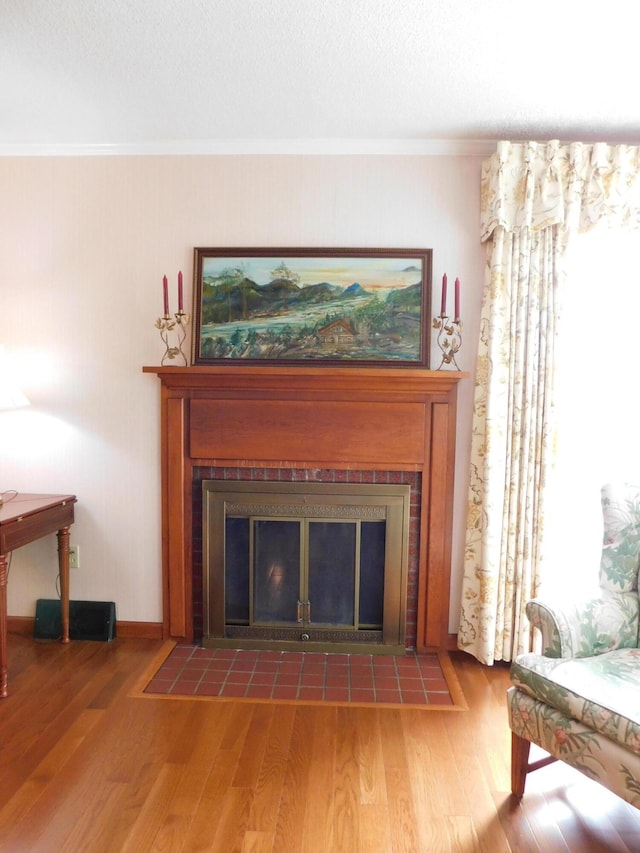 184 Meadow Dr, Harlan, KY 40831 - detailed view of a tile fireplace, wood finished floors, ornamental molding, and baseboards