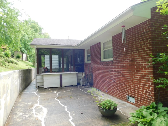 184 Meadow Dr, Harlan, KY 40831 - view of patio featuring a sunroom