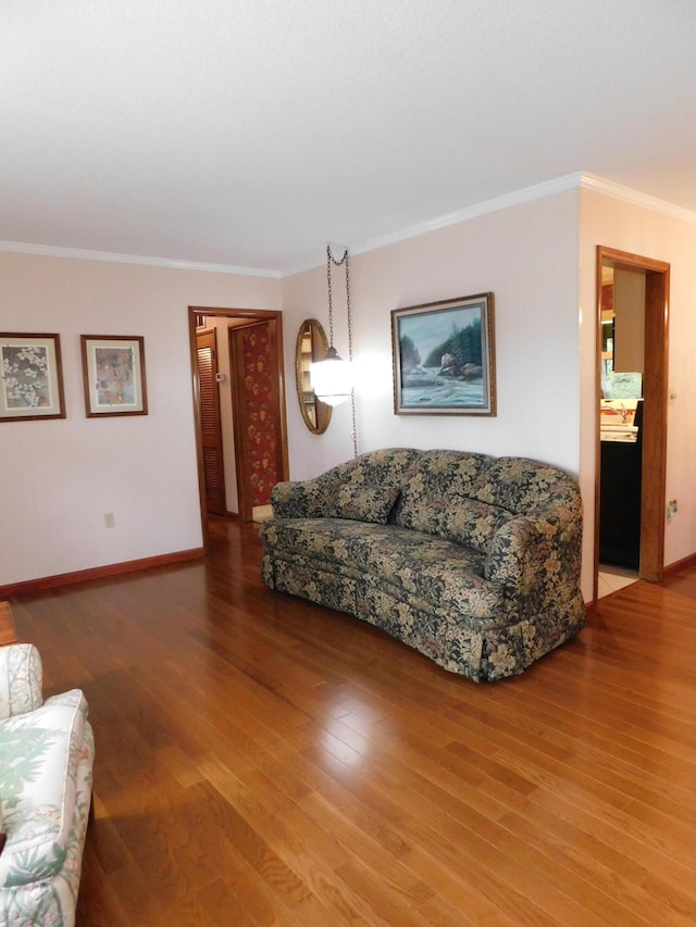 184 Meadow Dr, Harlan, KY 40831 - living area with wood finished floors, ornamental molding, and baseboards