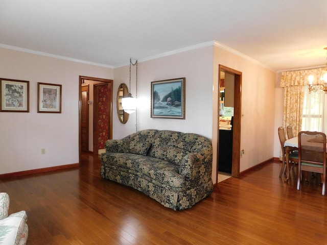 184 Meadow Dr, Harlan, KY 40831 - living area with a chandelier, wood finished floors, crown molding, and baseboards