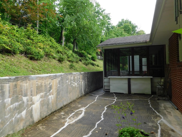 184 Meadow Dr, Harlan, KY 40831 - view of patio featuring a sunroom