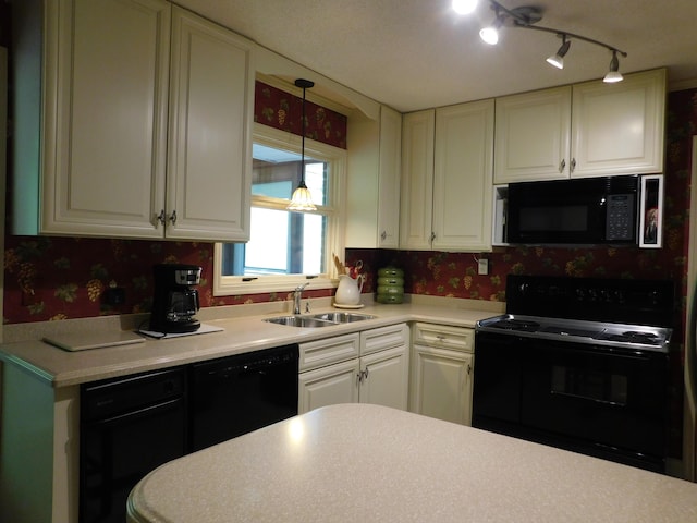 184 Meadow Dr, Harlan, KY 40831 - kitchen with black appliances, wallpapered walls, a sink, light countertops, and white cabinetry