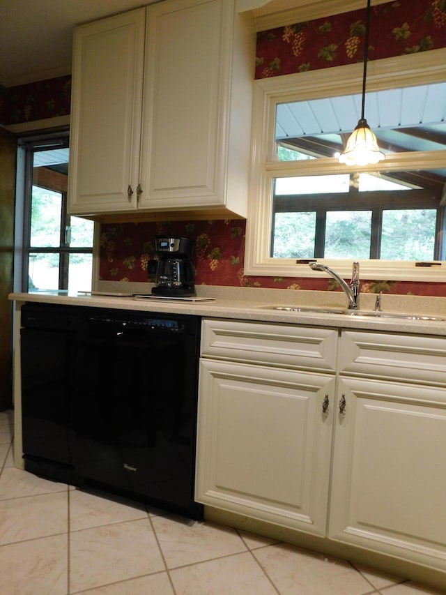 184 Meadow Dr, Harlan, KY 40831 - kitchen with black dishwasher, a sink, light tile patterned floors, wallpapered walls, and light countertops
