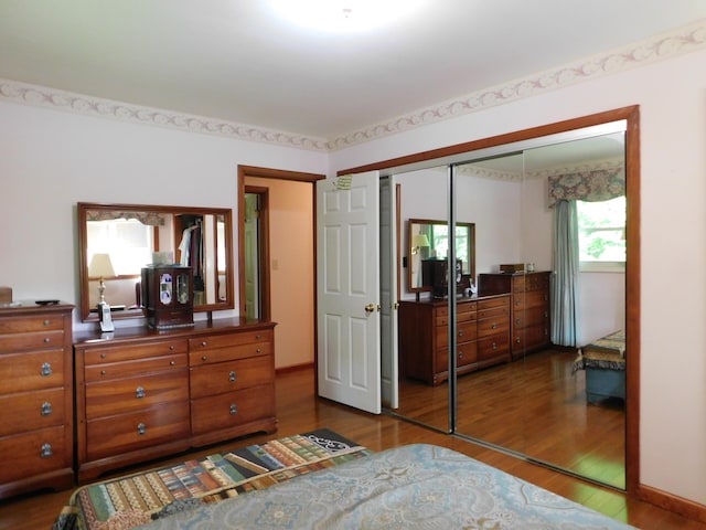 184 Meadow Dr, Harlan, KY 40831 - bedroom with dark wood finished floors and a closet