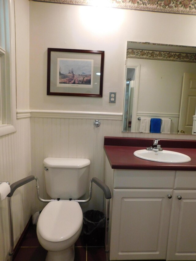 184 Meadow Dr, Harlan, KY 40831 - half bathroom featuring a wainscoted wall, vanity, and toilet