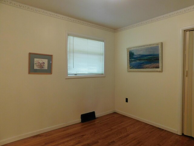 184 Meadow Dr, Harlan, KY 40831 - empty room with dark wood finished floors and baseboards