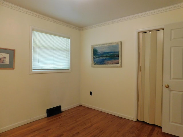 184 Meadow Dr, Harlan, KY 40831 - spare room featuring dark wood-type flooring and baseboards
