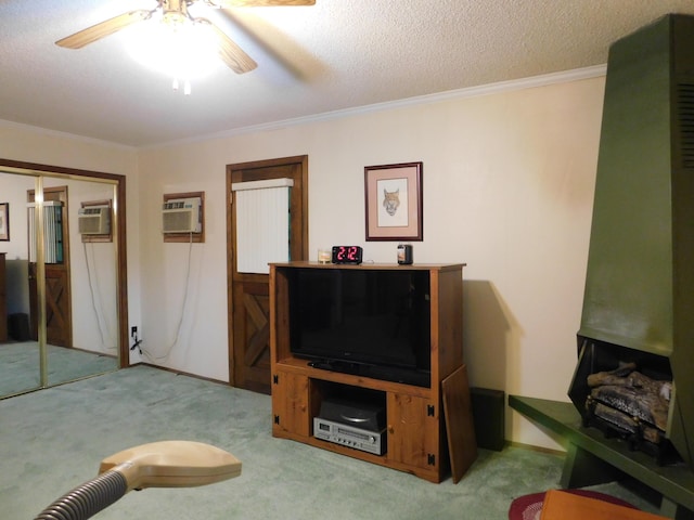 184 Meadow Dr, Harlan, KY 40831 - living area with carpet, ornamental molding, ceiling fan, a textured ceiling, and an AC wall unit