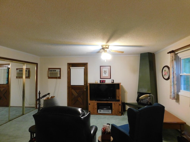 184 Meadow Dr, Harlan, KY 40831 - living area with carpet floors, a ceiling fan, a wall mounted air conditioner, a textured ceiling, and crown molding