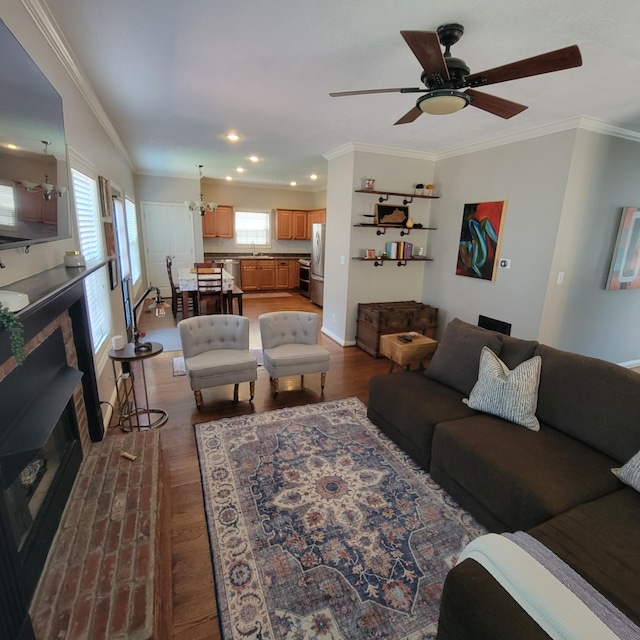 1136 Oatlands Park, Lexington, KY 40509 - living room featuring dark wood-type flooring, crown molding, recessed lighting, ceiling fan, and a brick fireplace