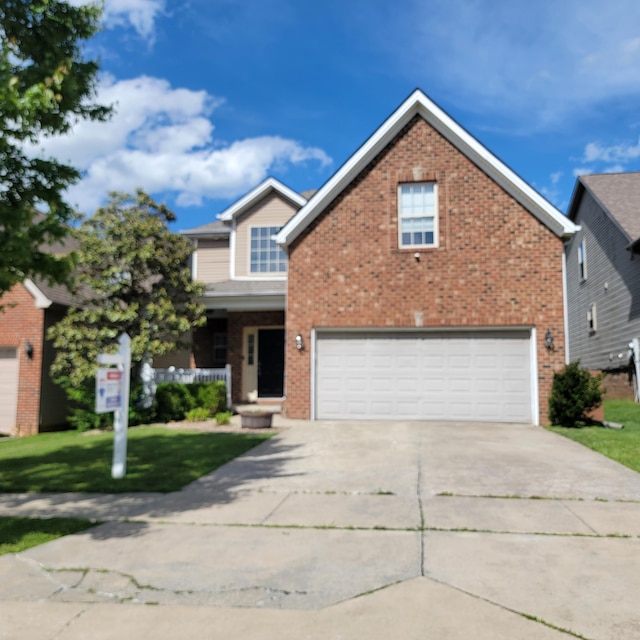traditional-style home with a garage, brick siding, driveway, and a front yard
