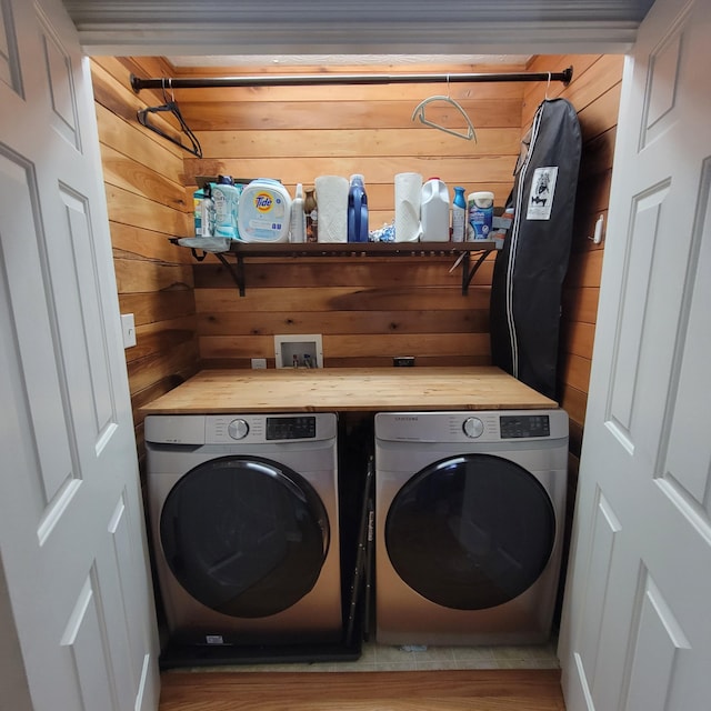 1136 Oatlands Park, Lexington, KY 40509 - washroom with washing machine and clothes dryer, wooden walls, and wood finished floors