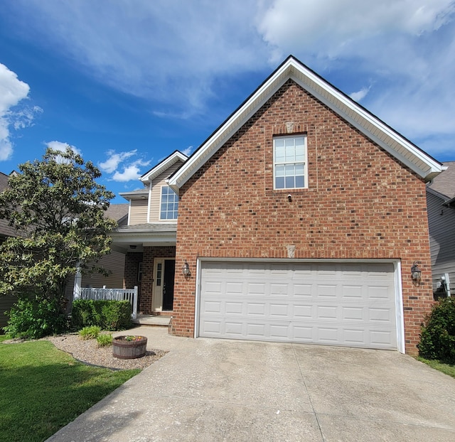 1136 Oatlands Park, Lexington, KY 40509 - view of front of property featuring brick siding, concrete driveway, covered porch, and an attached garage