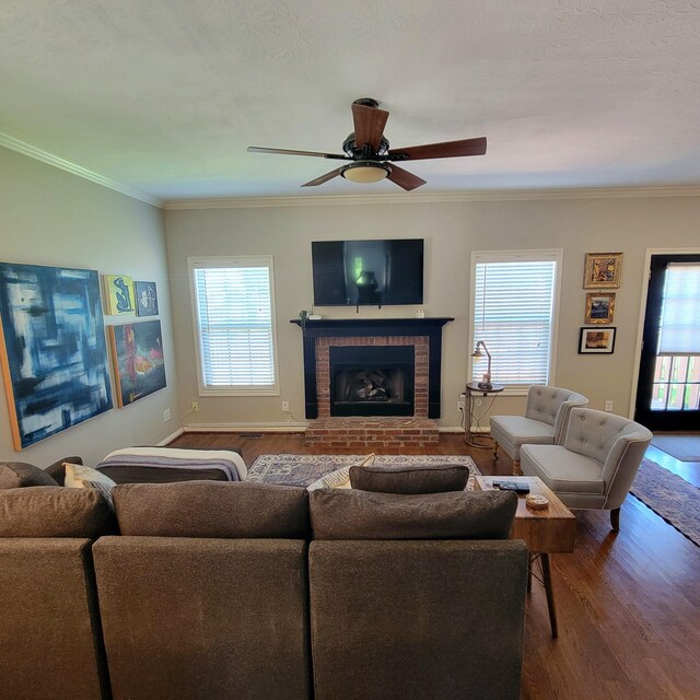 1136 Oatlands Park, Lexington, KY 40509 - living area with wood finished floors, plenty of natural light, a ceiling fan, a brick fireplace, and ornamental molding