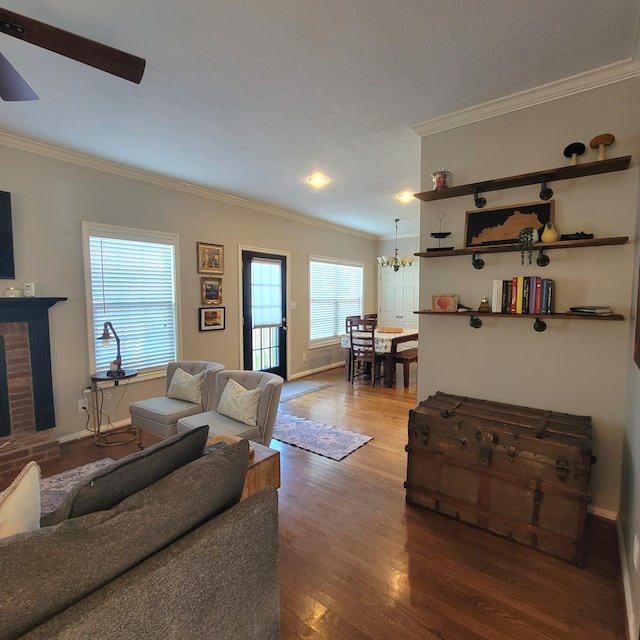 1136 Oatlands Park, Lexington, KY 40509 - living room with ornamental molding, wood finished floors, a chandelier, a ceiling fan, and baseboards