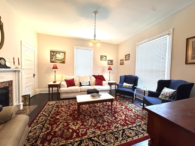 8 N Sycamore St, Mt Sterling, KY 40353 - living room featuring dark wood finished floors, healthy amount of natural light, a premium fireplace, and baseboards