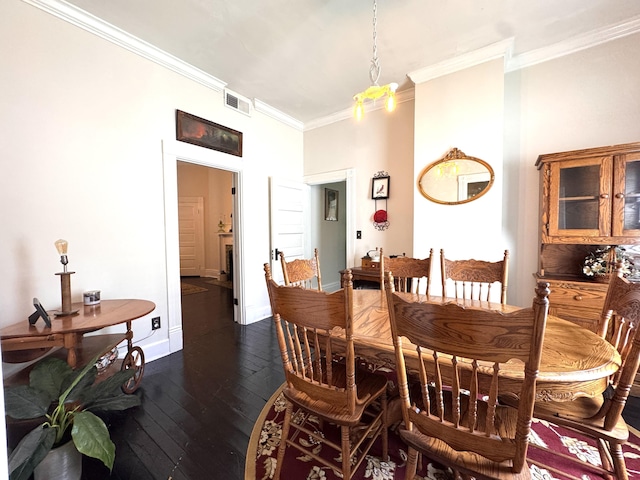 8 N Sycamore St, Mt Sterling, KY 40353 - dining room featuring crown molding, dark wood-style flooring, and baseboards