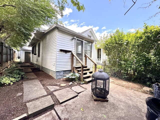 8 N Sycamore St, Mt Sterling, KY 40353 - rear view of house with entry steps and an outdoor fire pit
