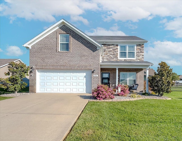 traditional-style home with brick siding, a front lawn, driveway, covered porch, and a garage