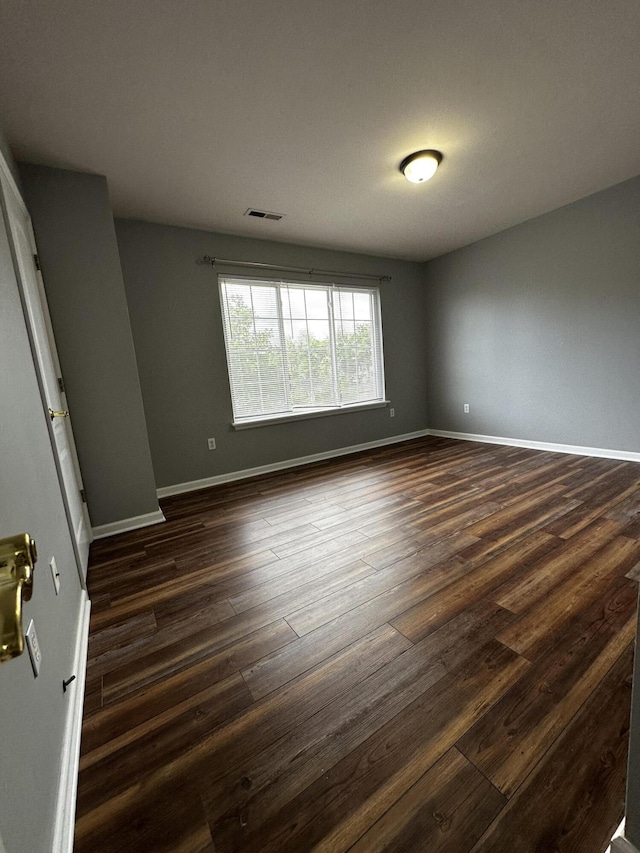 1213 Seminole Trl, Georgetown, KY 40324 - empty room with dark wood finished floors and baseboards