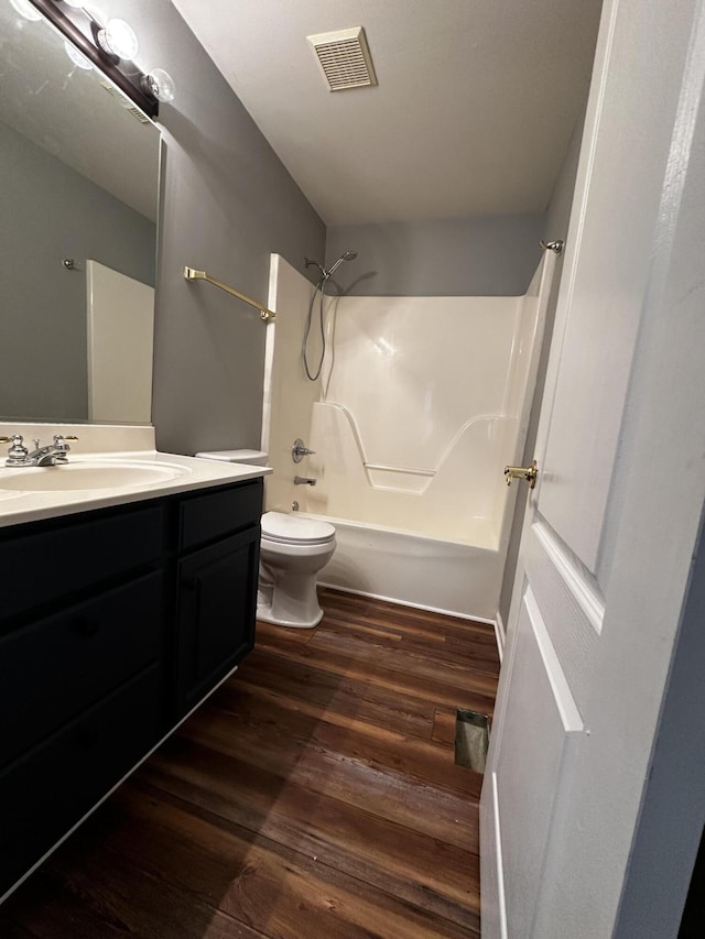 1213 Seminole Trl, Georgetown, KY 40324 - full bath featuring  shower combination, wood finished floors, toilet, and vanity