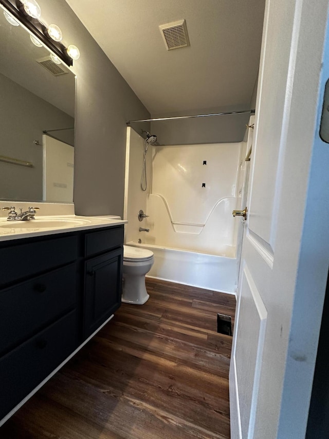 1213 Seminole Trl, Georgetown, KY 40324 - bathroom featuring toilet, wood finished floors, shower / washtub combination, and vanity